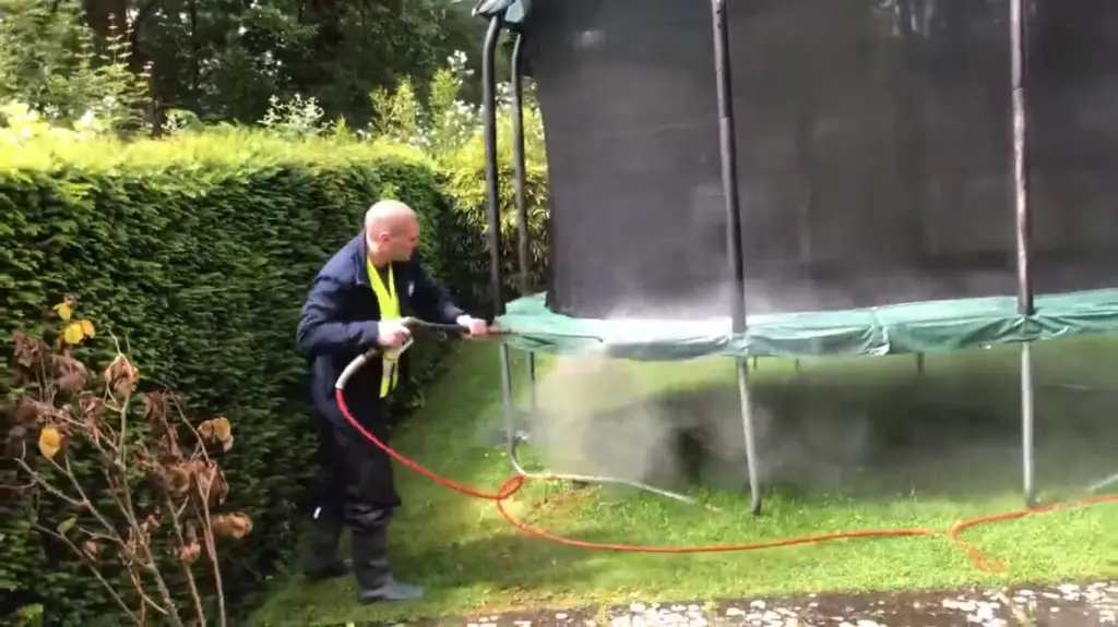 Rinse off trampoline with a hose